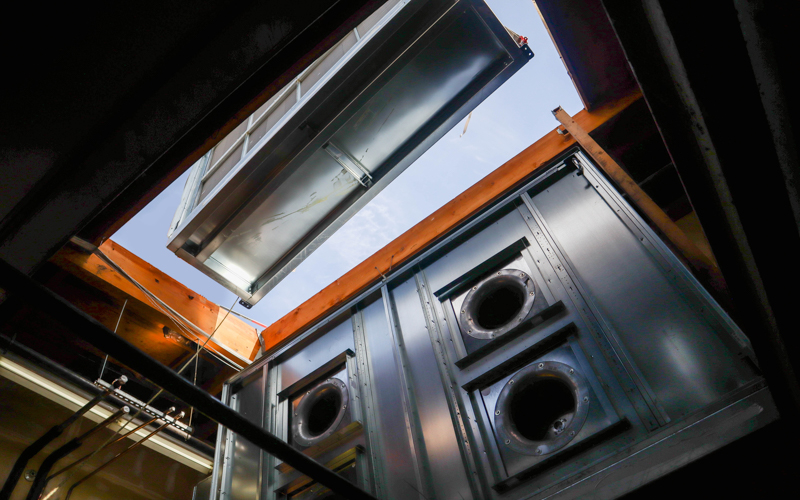Air handler being installed through roof in Turlock CA