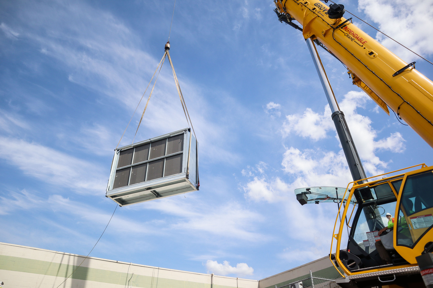 air-handler-lifted-by-crane Air handler being lifted by crane