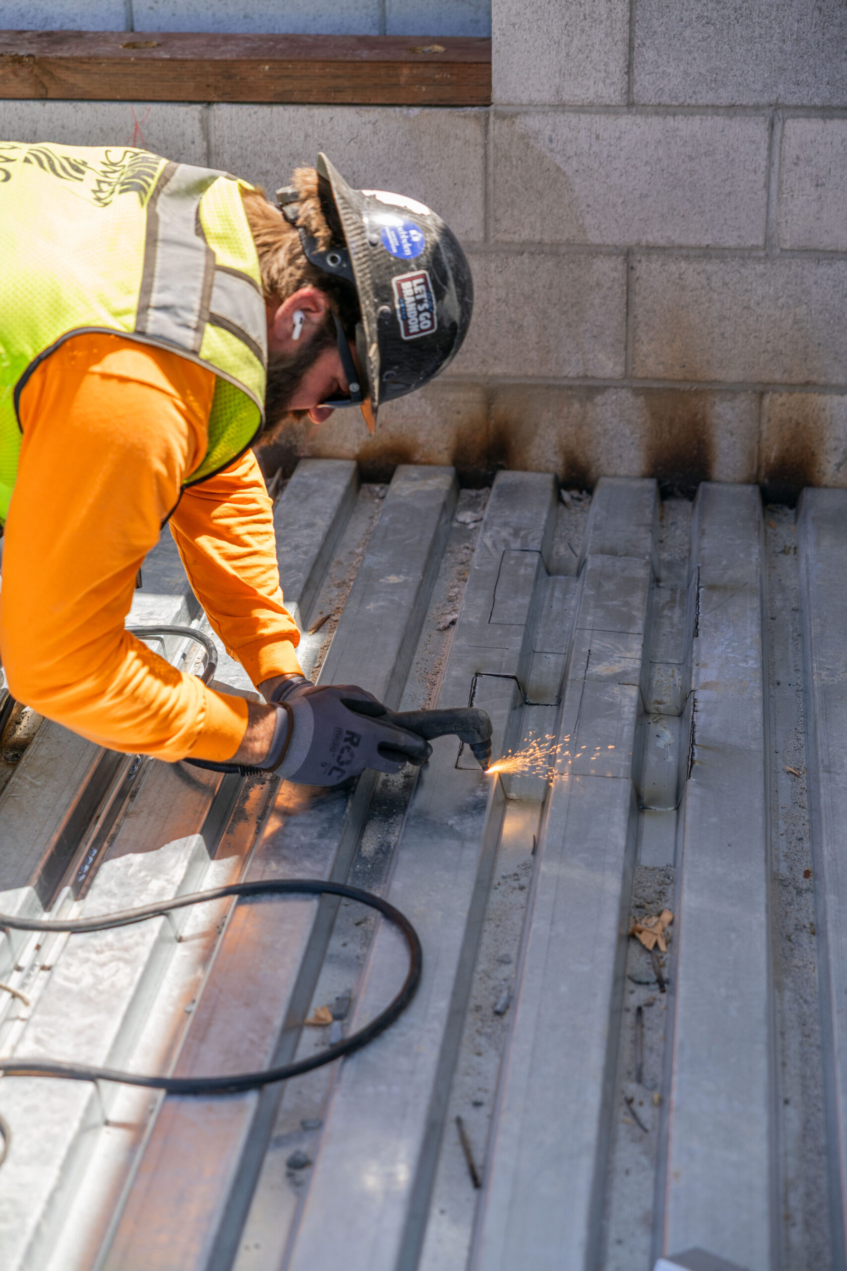 construction-plumber-working-in-sacramento Plumber brazing roof drains