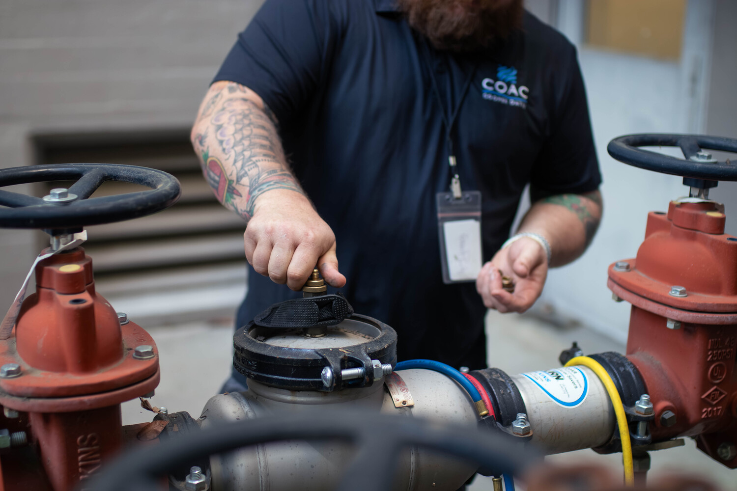 Plumber in Sacramento Testing a Backflow